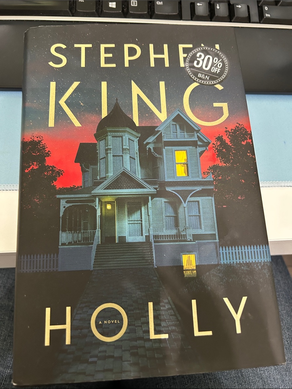 Stephen King - Holly (Hardcover) in Black, Red, Yellow